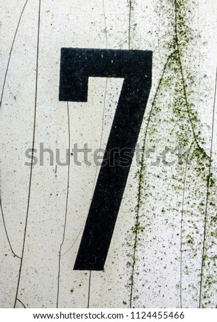 Written Wording in Distressed State Typography Found Number Seven 7