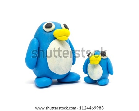 Play dough Penguin father and son on white background. Handmade clay plasticine