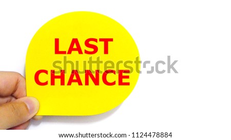 Hand holding Last Chance text in red on yellow tag for sales promotions and advertising concept