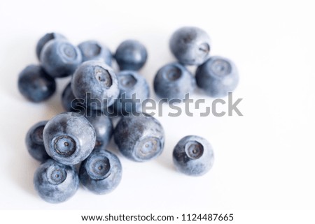 Forest blueberries on a white background close up, soft focus. Summer wild berry
