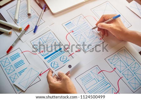ux Graphic designer creative  sketch planning application process development prototype wireframe for web mobile phone . User experience concept. Royalty-Free Stock Photo #1124500499