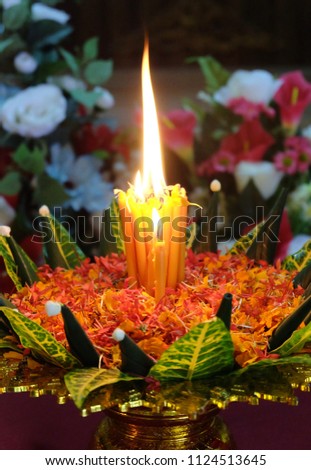 Fire of candles and flowers for worship in Buddhism.