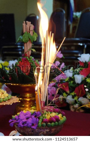 Fire of candles and flowers for worship in Buddhism.