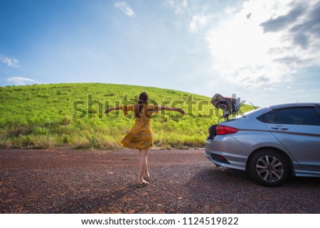 Woman traveler and car