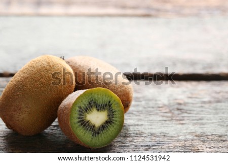 Kiwi fruits on wooden table