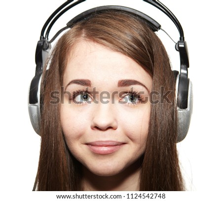 Happy girl with headphones listening to music