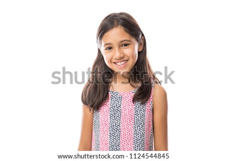 Portrait of young beautiful little girl with t-shirt smiling to camera over white background