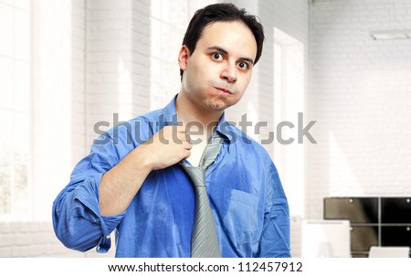 Sweating businessman due to hot climate Royalty-Free Stock Photo #112457912