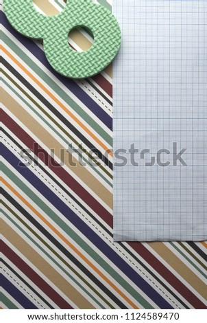 different types of business, school and office accessories on colorful geometric paper background