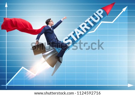 Superhero businessman in start-up concept flying rocket