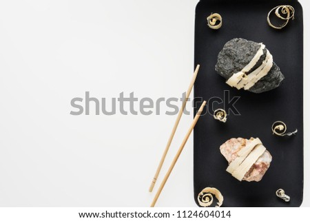 The concept of natural food. Abstract sushi made from stones and wood. Eco concept.