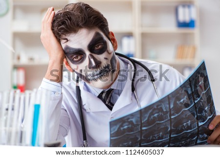 Scary monster doctor working in lab Royalty-Free Stock Photo #1124605037
