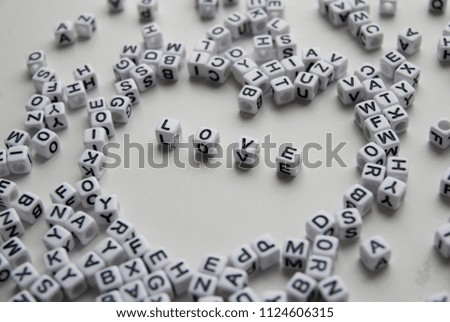 love  word written on cubes on white background. Creative text for your business. Chaotic letters design.