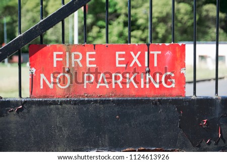 Fire exit no parking sign entrance gate guarded secure workplace station brigade red black