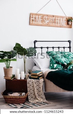 Stylish interior design with tropical leaves