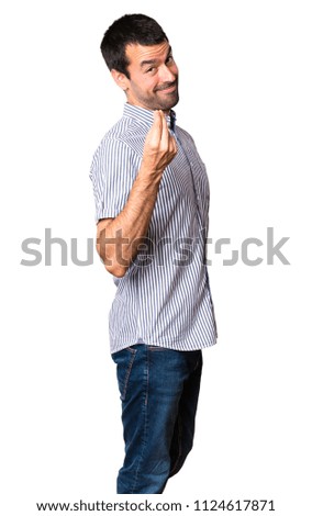 Handsome man making money gesture on isolated white background
