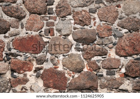 Stone wall of the old castle texture background