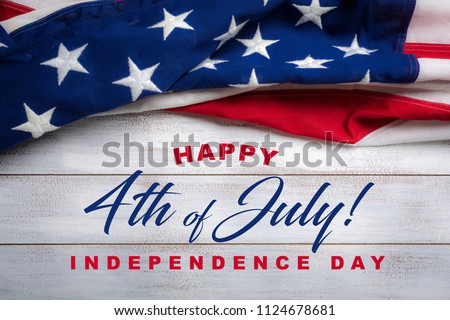 United states flag on white, weathered clapboard background with july 4th greeting Royalty-Free Stock Photo #1124678681