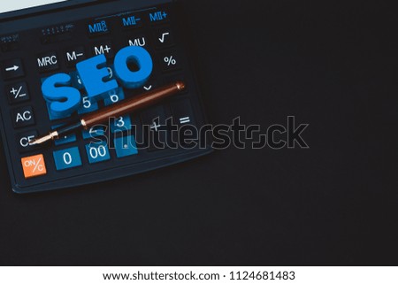 SEO text alphabet for Search Engine Optimization concept and Office supplies or office work essential tools or item calculator, business SEO.