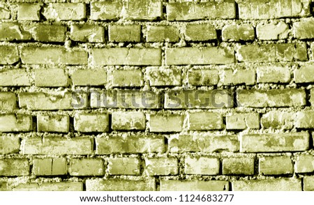 Grungy weahered brick wall in yellow tone. Abstract background and texture for design.