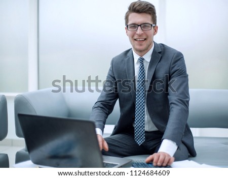 successful businessman sitting at his Desk
