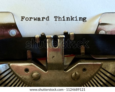 Forward Thinking, title heading typewritten on white paper on vintage manual typewriter machine
