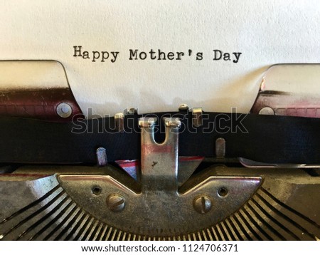 Happy Mother's Day, typewritten on white paper on vintage manual typewriter machine