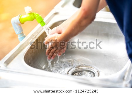 Blurry water tap for cleaning, washing and drinking water on sink