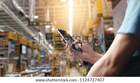 
Factory worker using application on mobile smartphone to operrate automation for modern trade. Checking order in large warehouse. Import and export the shipping cargo. Royalty-Free Stock Photo #1124727407