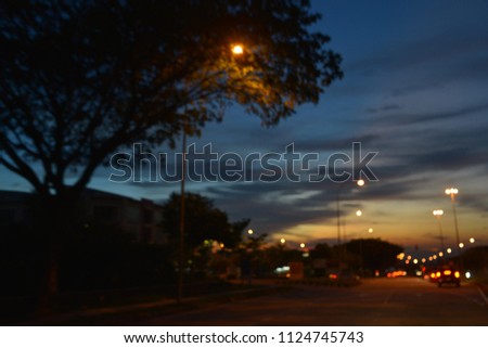 De-focus of bokeh light from cars on the traffic road with space for your text and design. Concept be used for transportation, traffic jam news and background. Blur picture.