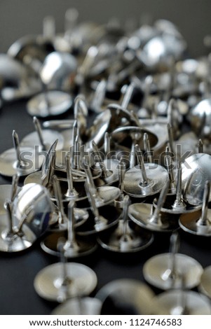 A studio photo of drawing pins