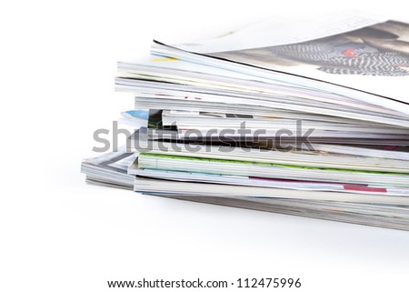stack of magazines on white background Royalty-Free Stock Photo #112475996