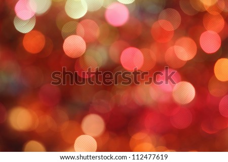 Red and orange holiday bokeh. Abstract Christmas background Royalty-Free Stock Photo #112477619