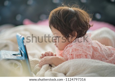chinese child addicted phone, asian girl playing smartphone, kid use telephone, watching smartphone, watching cartoon
