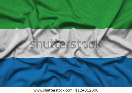 Sierra Leone flag  is depicted on a sports cloth fabric with many folds. Sport team banner