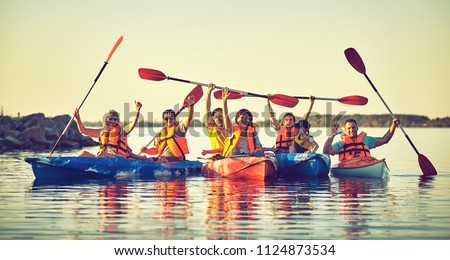 Kayaking and canoeing with family. Children on canoe. Family on kayak ride. Royalty-Free Stock Photo #1124873534
