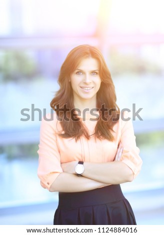 portrait of modern young woman on blurred office background