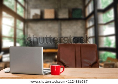 
workspace with computer, office supplies, and coffee cup at cafe. desk work concept. in morning light
