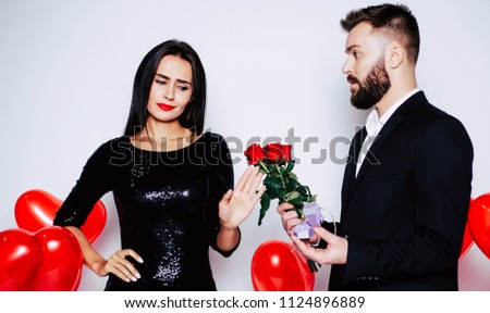 Sorry, but no! Young attractive woman are refusing of wedding ring from handsome bearded man in suit. Bad proposal result