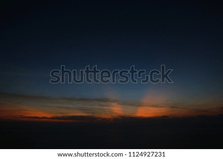 Sea landscape and sunrise sky with orange clouds. Concept of calm photo for background.