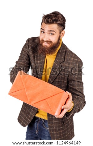 portrait of bearded businessman with gift box. human emotion expression and office, business, finances concept. image isolated white background.