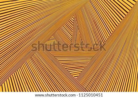 Abstract photo montage of yellow orange timber. Converging lines of planks. 