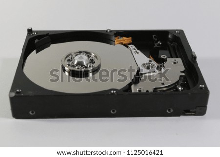 Computer hard disk internal hardware.  Encrypted disk drive. Data security or hdd of personal computer  on white and gray background