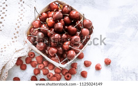 cherry in a small basket, the concept of fruit and healthy eating
