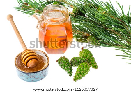 Honey from green pine cones. Studio Photo Royalty-Free Stock Photo #1125059327