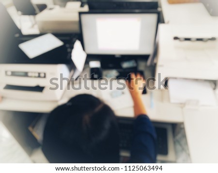 woman use computer working in office, blurred office rooms in hospitals, abstract office, blur background, vintage tone