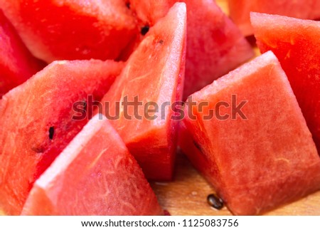 Close Up Of Sliced Watermelon On The Wooden Background. Food Background. Macro Photography 