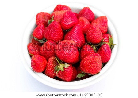Many strawberries in a bowl.