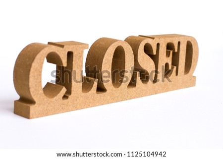 Closed text from wooden alphabet isolated on white background .