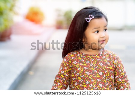 Portrait beautiful little girl Asian happiness shot outdoors, 2-3 year old